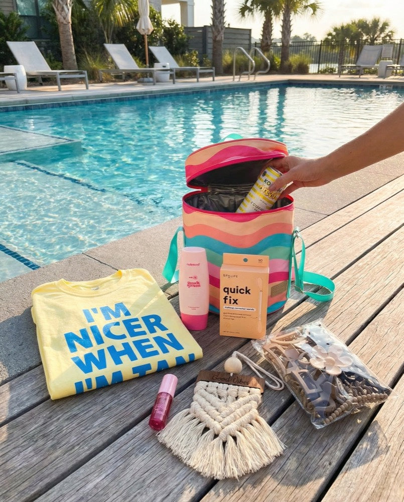 A Bhaddie bag poolside with a tee and goodies